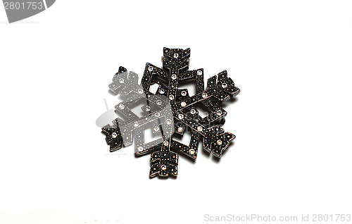 Image of Silver brooch in the form of snowflakes