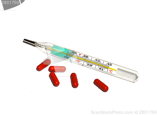 Image of Medical thermometer and pills