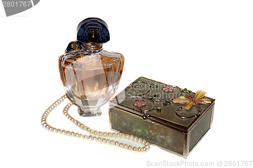 Image of Perfume bottle, casket and a string of pearls