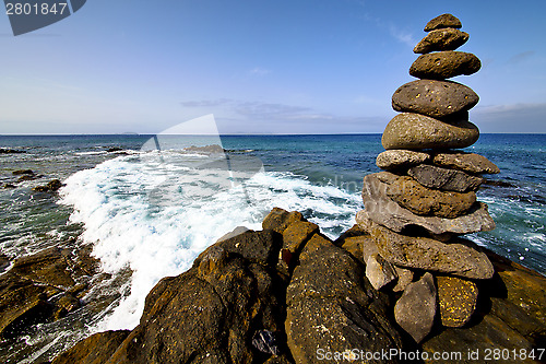 Image of in lanzarote coastline  froth    rock stone sky cloud beach     