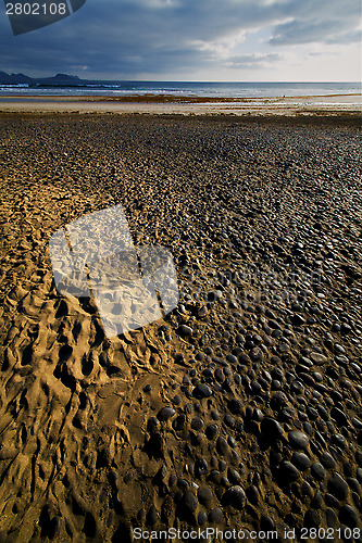 Image of rock stone sky cloud beach  water  coastline 
