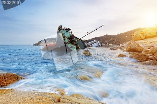 Image of shipwreck and seascape sunset 