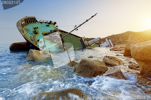 Image of shipwreck and seascape sunset 