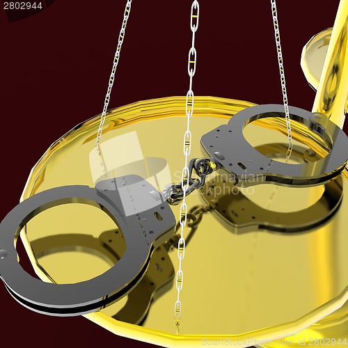 Image of Scales of justice and handcuffs