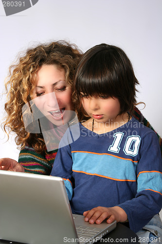 Image of Mother and son at computer