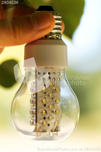 Image of Light bulb held in palm