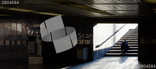 Image of Lonely man sitting on the stairs