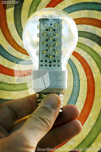 Image of Light bulb held in palm