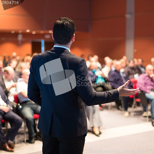 Image of Speaker at Business Conference and Presentation.