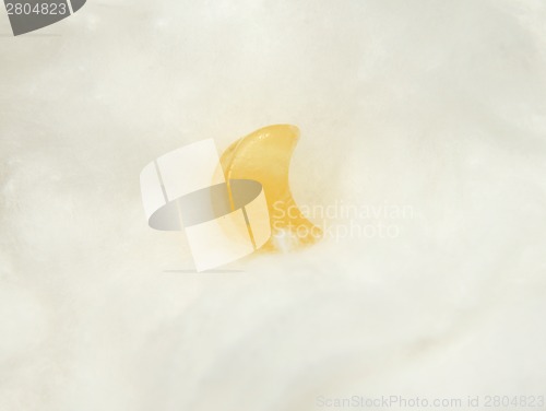 Image of Orange calcite mineral on cotton