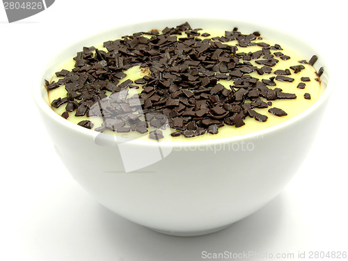 Image of Custard with grated chocolate in a bowl of china ware