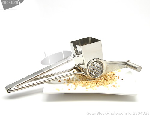Image of Grater with hazelnuts