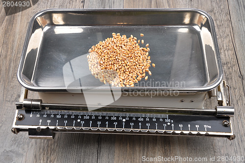 Image of Old kitchen scales on wood