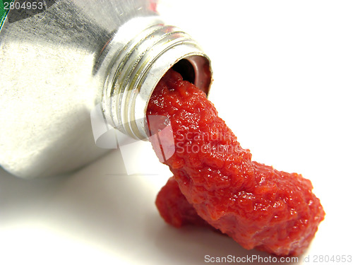 Image of Tomato puree pressed out of a tomato tube