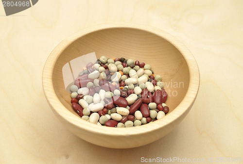 Image of Detailed but simple image of legumes on wood