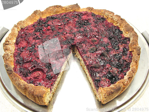 Image of Cutted berry cake on a cake tray