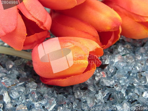 Image of plastic tulips on glitter