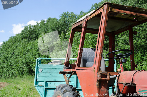 Image of old rd work tractor outdoor  