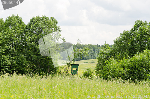 Image of small green hunter watch tower in nature  