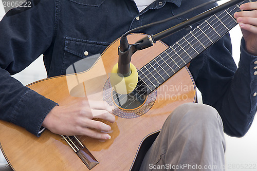 Image of Playing guitar