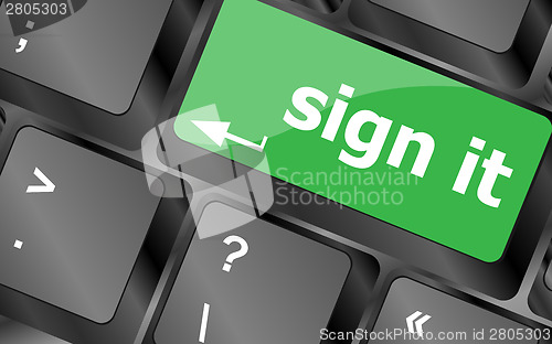 Image of sign it or login concept with key on computer keyboard