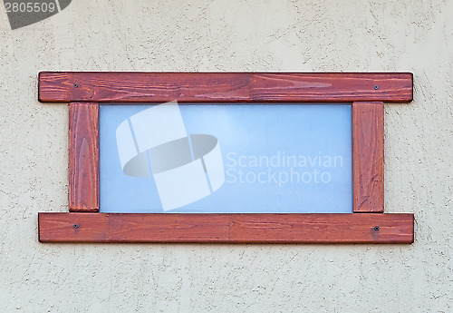 Image of Window in a wooden frame.