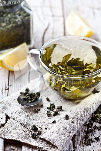 Image of cup of green tea and lemon