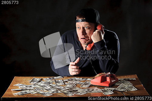 Image of startled man with phone 