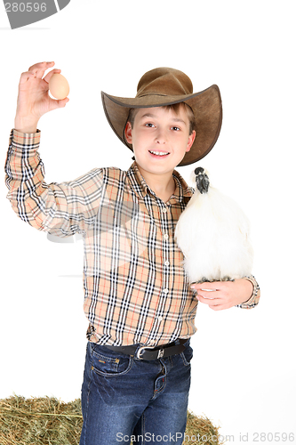 Image of Boy with chicken and egg