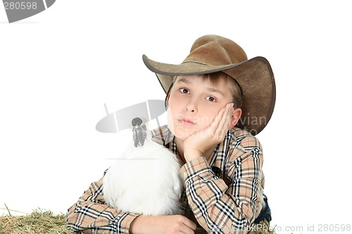 Image of Country boy with farm animal with copyspace