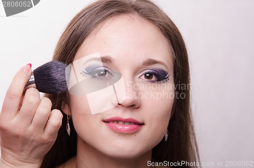 Image of Beautiful girl powder applied to the face