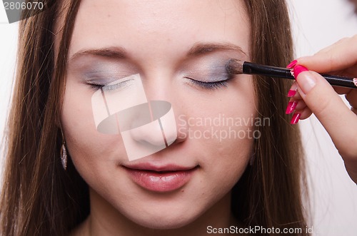 Image of Makeup artist paint brush forever young girl