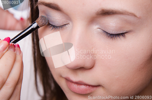 Image of Beautiful girl paint eyelids
