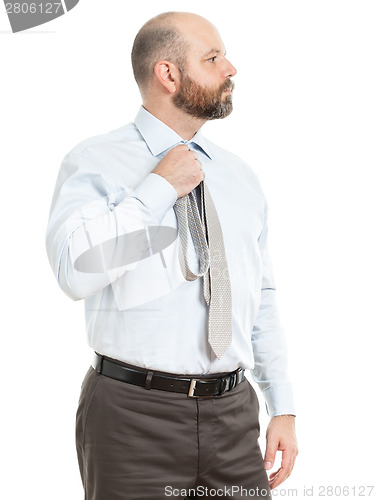 Image of business man selects tie