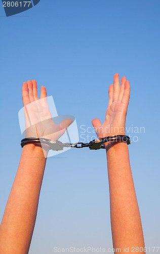 Image of Handcuffed woman hands
