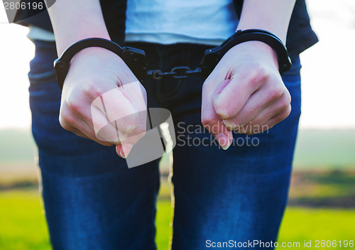 Image of Woman with handcuffed hands