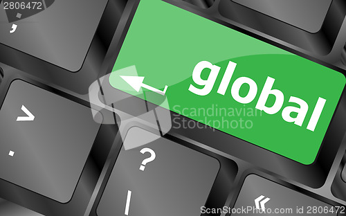 Image of Global button on the keyboard - business concept