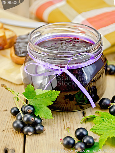 Image of Jam blackcurrant with a napkin on board