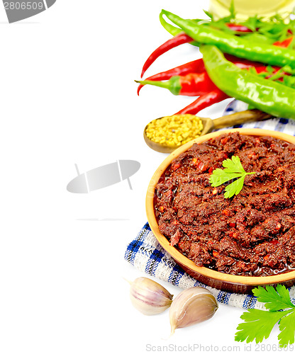 Image of Adjika with hot pepper and spices on napkin