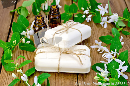 Image of Soap and oil white with  flowers of honeysuckle on board