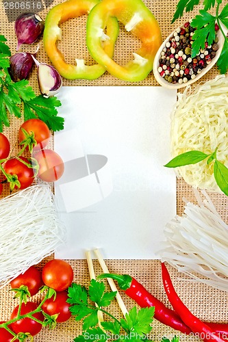 Image of Frame of vegetables and funchozy with paper on sackcloth