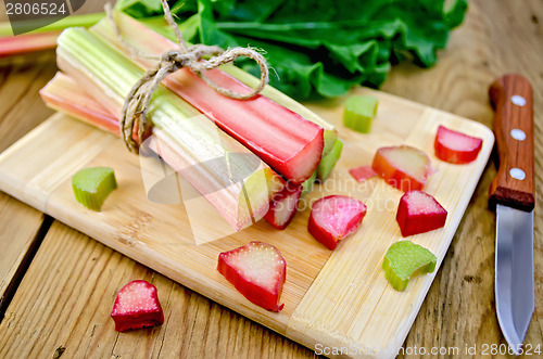 Image of Rhubarb cut on board with knife