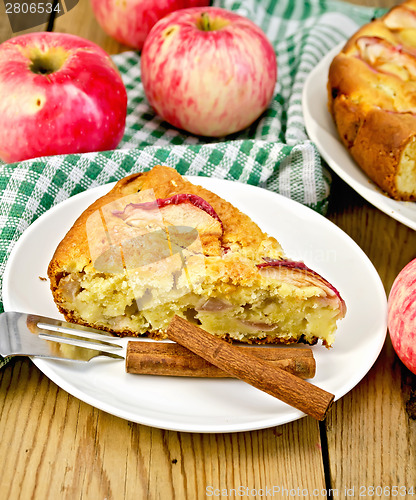 Image of Pie with apples on plate and board