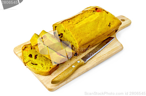 Image of Fruitcake pumpkin with candied fruits on wooden board