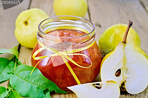 Image of Jam pear with leaves on board