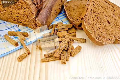 Image of Rye homemade bread on board with crackers