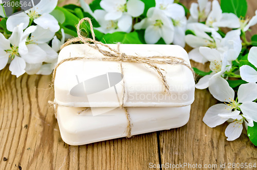 Image of Soap with white flowers of apple on board