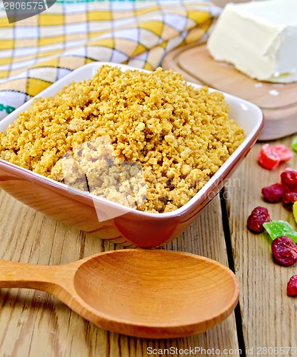 Image of Curd red in bowl with candied fruit and spoon