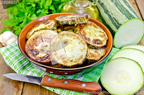 Image of Zucchini fried with napkin on board