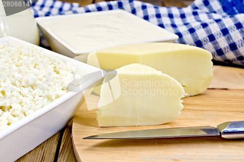 Image of Cheese suluguni with curd and sour cream on board